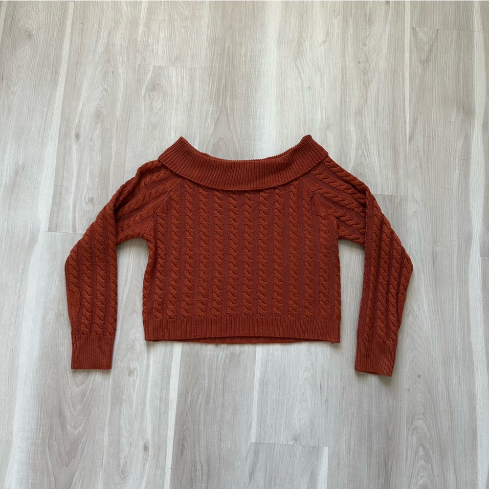 Large off shoulder, deep orange autumn sweater.